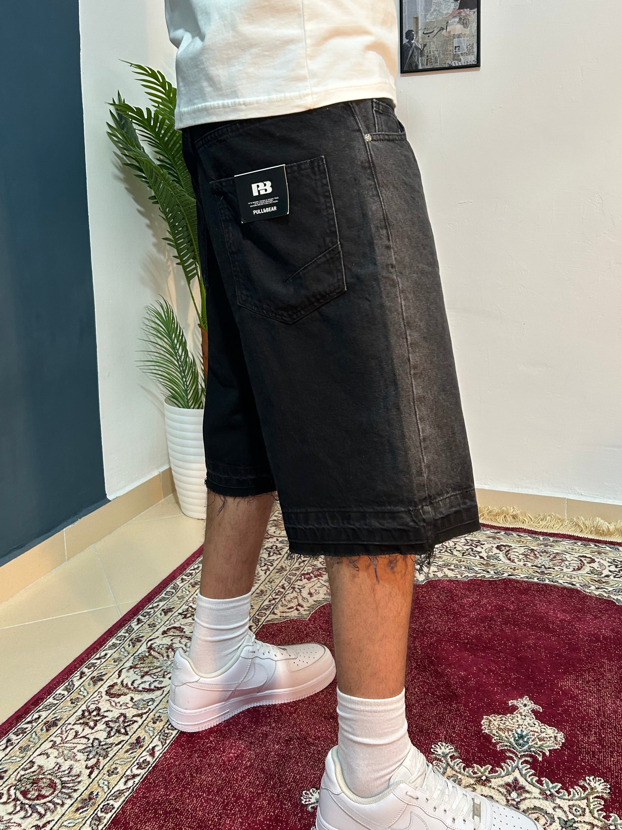 black baggy jeans shorts